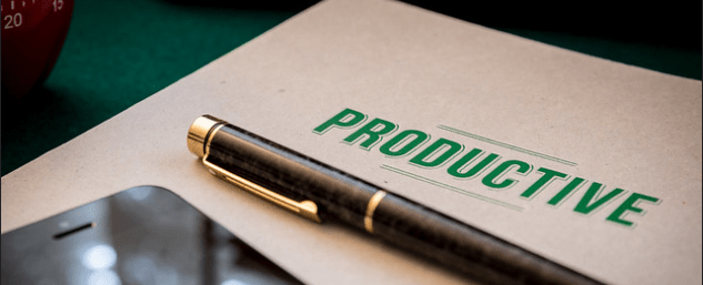 A photo of a book entitled "Productive" with pen and mobile phone placed on top of the book.