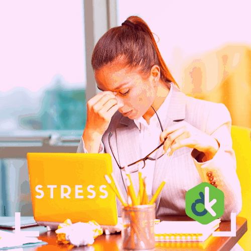 A woman resting her eyes and taking a small break from her work. She seems visibly stressed out.