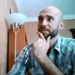 Nick Loper looking to his top-right while holding a contemplating pose.