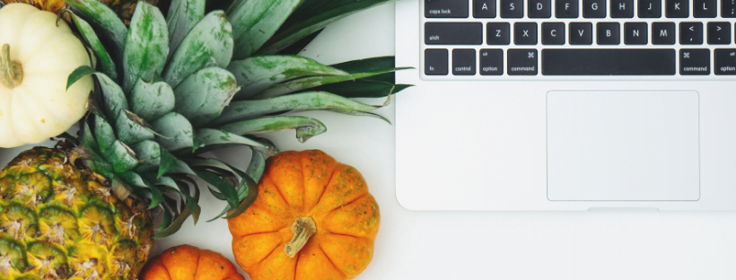 Eat right Fruits and vegetables beside a laptop.