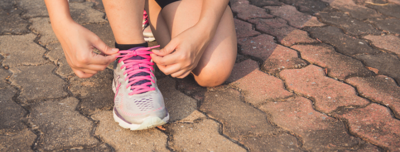 Exercise A person tying their shoe lace to get ready for a run.