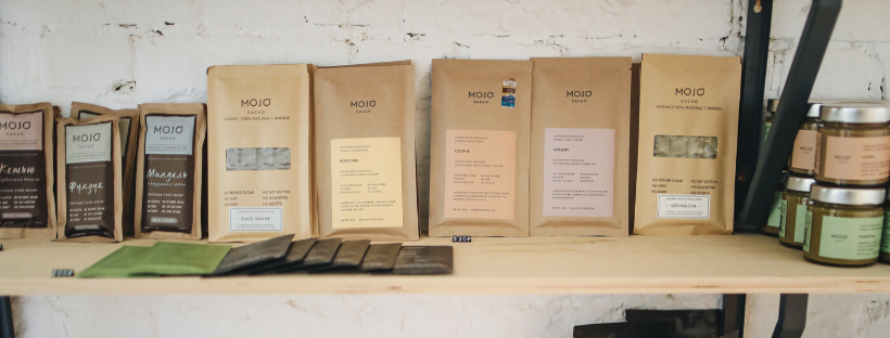 Mojo productions stacked horizontally on a shelf.