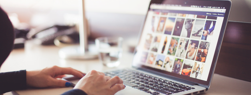 Social Media Person browsing the web. Blue nail paint is visible on their nails.