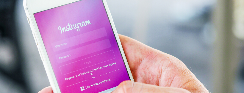 A person logging in into their Instagram account on an iPhone.
